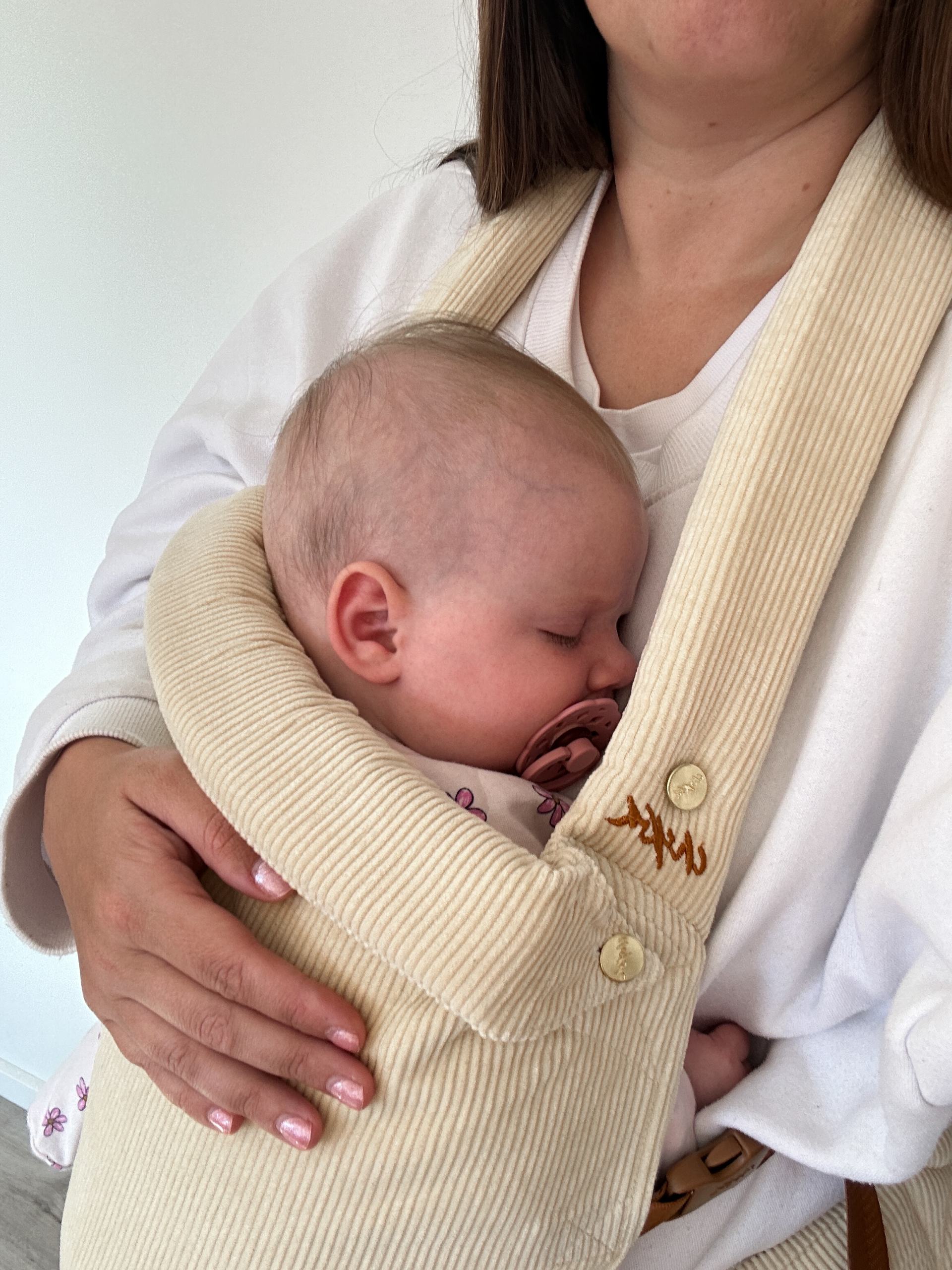 baby in a chekoh baby carrier